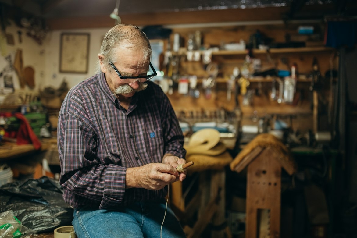 An old man in a workshop